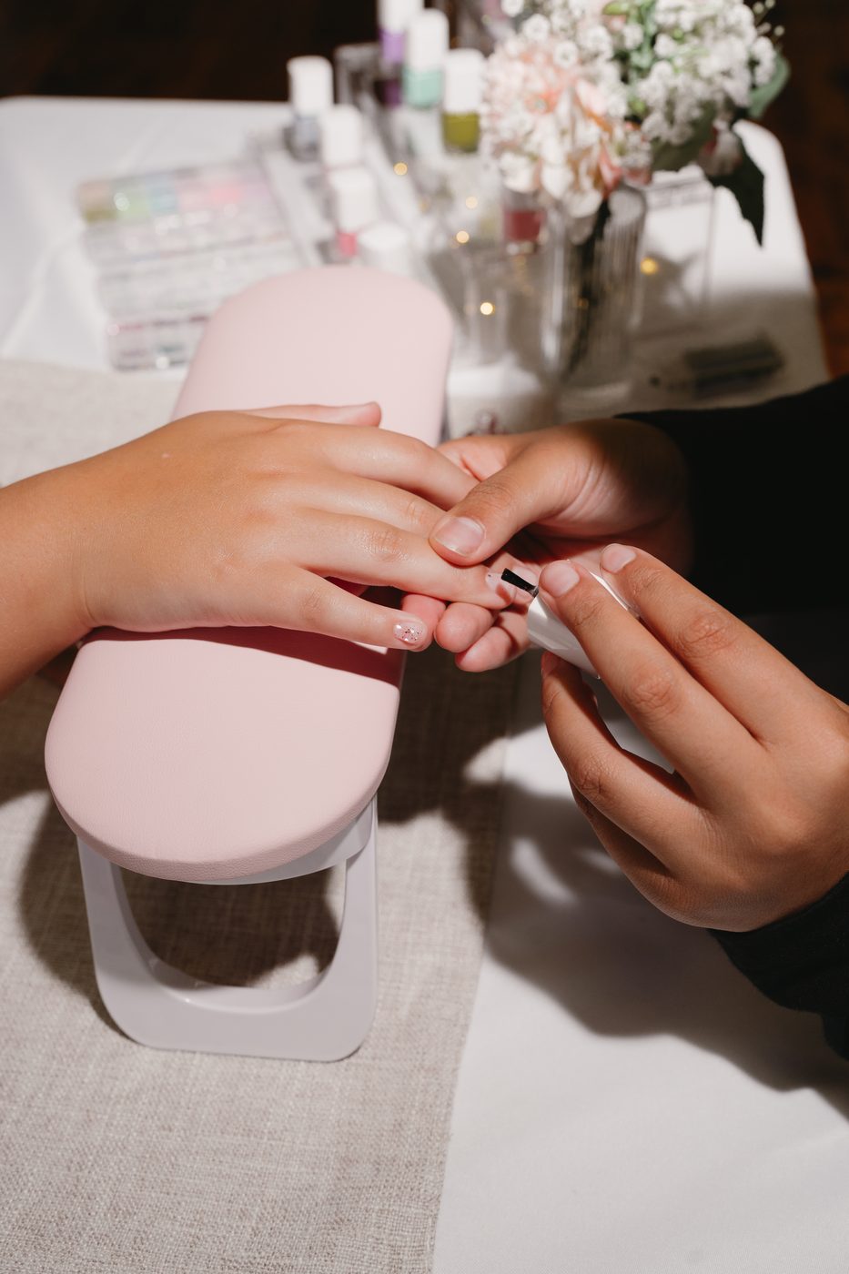 Close-up of a manicure in progress at a mobile kids spa party