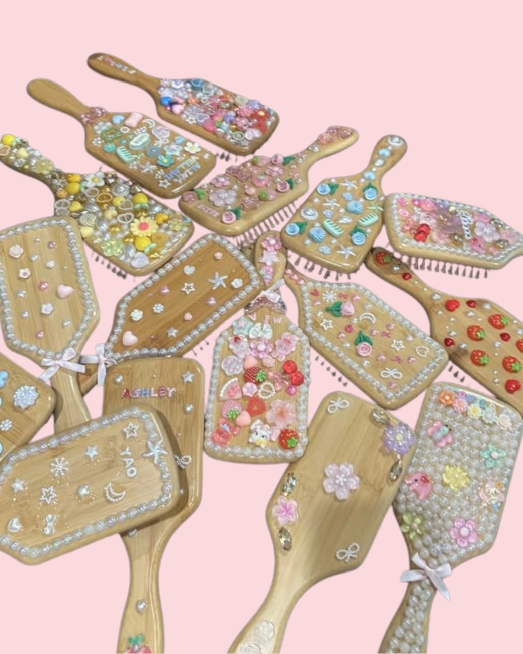 A collection of decorated hairbrushes with pearls, charms, and rhinestones from the Decorate Your Own Hairbrush upgrade